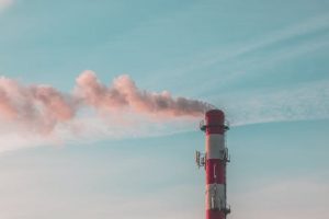 tower emitting smoke against the sky